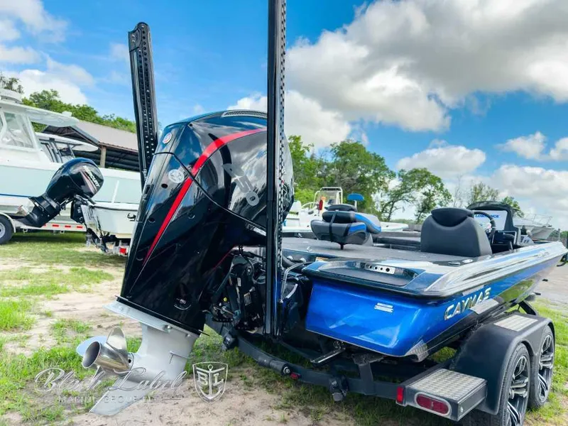 Slide: The Image of 2023 Caymas CX 20 PRO boat with powerful outboard motor, parked on a trailer. - 6