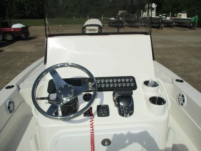 Slide: The Image of 2025 Skeeter SX241 boat console with steering wheel and controls. - 3