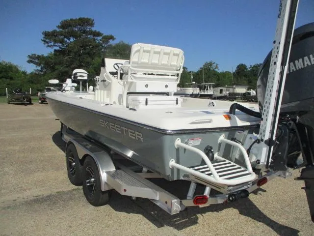 Slide: The Image of 2025 Skeeter SX241 boat on trailer, rear view, outdoors, clear sky. - 5