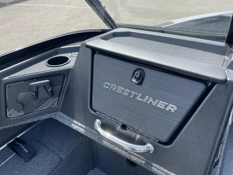 Slide: The Image of 2025 Crestliner 1750 Fish Hawk dashboard with storage compartment and cup holder. - 12