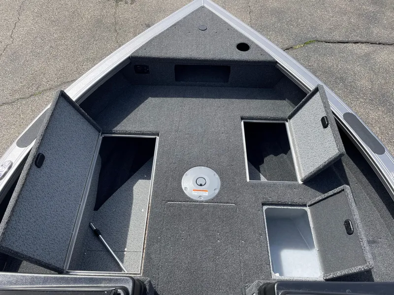 Slide: The Image of 2025 Crestliner 1750 Fish Hawk boat deck with open storage compartments. - 16