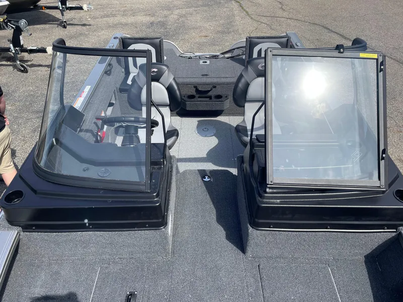 Slide: The Image of 2025 Crestliner 1750 Fish Hawk boat interior with dual consoles and seating. - 19