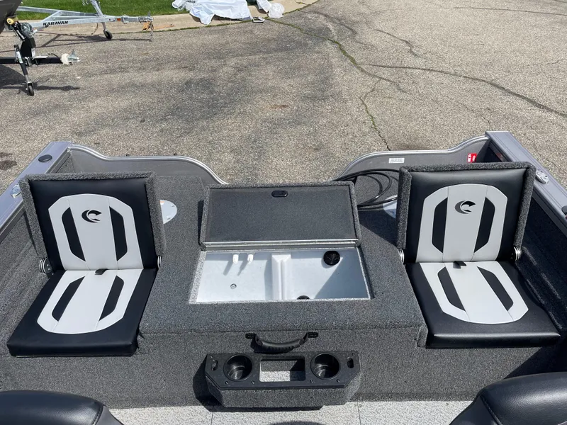 Slide: The Image of 2025 Crestliner 1750 Fish Hawk boat interior with seating and storage compartments. - 5