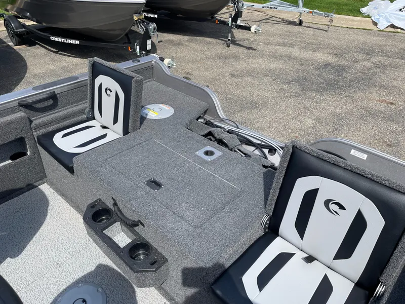 Slide: The Image of 2025 Crestliner 1750 Fish Hawk boat interior with seating and storage compartments. - 6