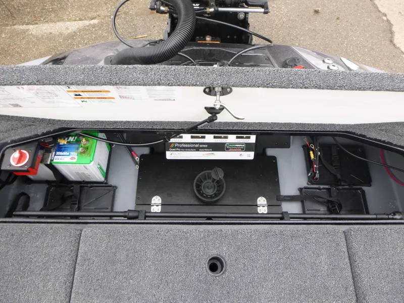 Slide: The Image of 2025 Ranger Z519R Cup-Equipped boat storage compartment with battery and wiring. - 11