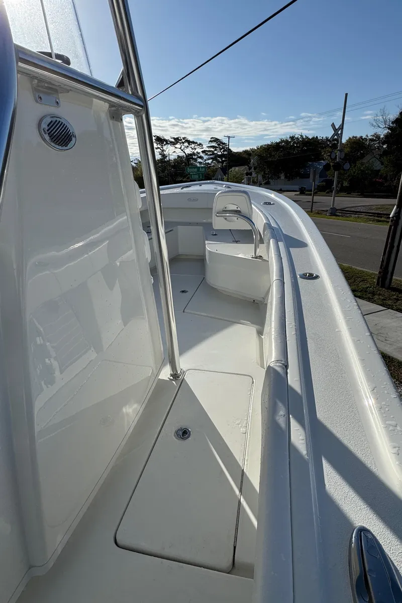 Slide: The Image of 2025 Pair Customs 24 Center Console DV boat, sleek white deck, modern design. - 6