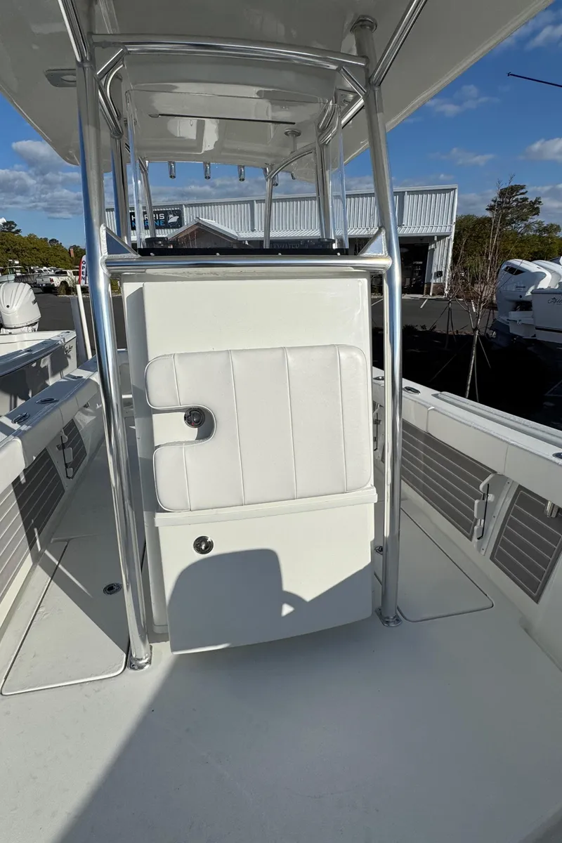 Slide: The Image of 2025 Pair Customs 24 Center Console DV boat with sleek white design and modern features. - 8