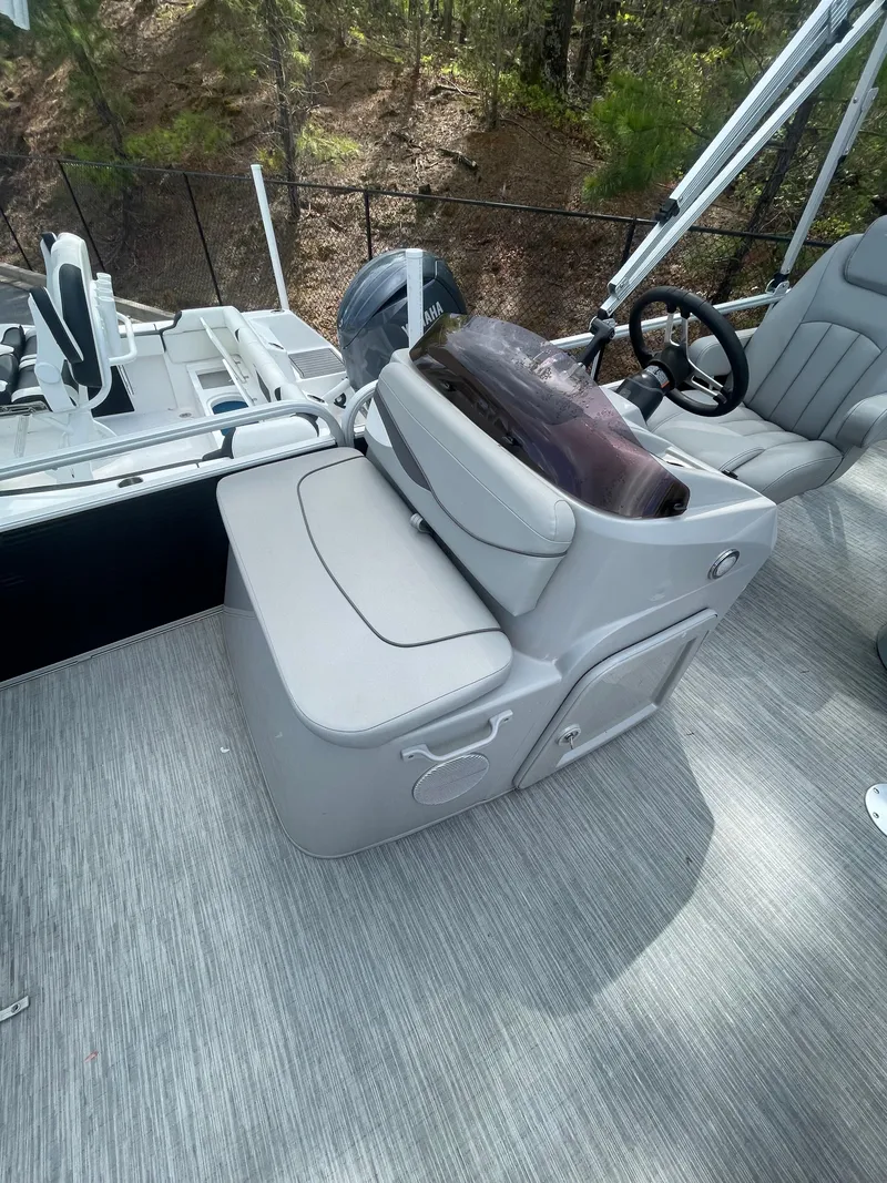 Slide: The Image of 2023 Bennington 20SV boat interior with steering console and seating, featuring modern design. - 6