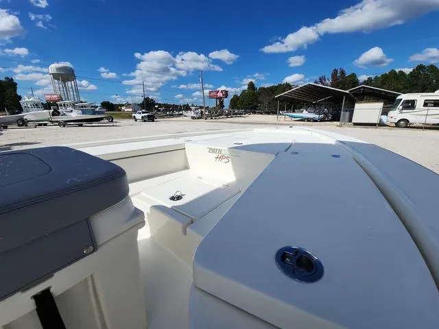 Slide: The Image of 2025 Pathfinder 2300 HPS boat on display under a clear blue sky. - 11