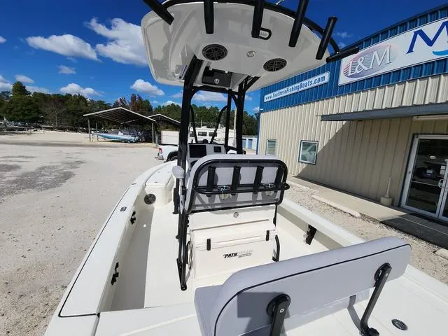 Slide: The Image of 2025 Pathfinder 2300 HPS boat at a dealership, featuring a sleek design and spacious deck. - 16