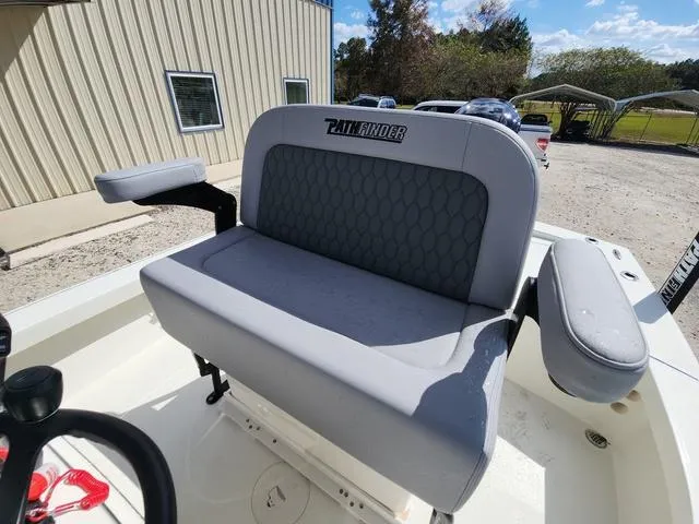 Slide: The Image of 2025 Pathfinder 2300 HPS boat seat with armrests, outdoor setting. - 23