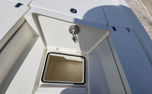 Slide: The Image of Open storage compartment on 2025 Pathfinder 2300 HPS boat deck. - 25