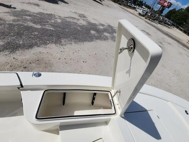 Slide: The Image of Open storage compartment on 2025 Pathfinder 2300 HPS boat, parked on gravel. - 30