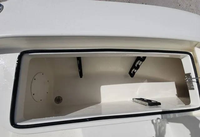 Slide: The Image of Open storage compartment of 2025 Pathfinder 2300 HPS boat, featuring a clean interior design. - 31