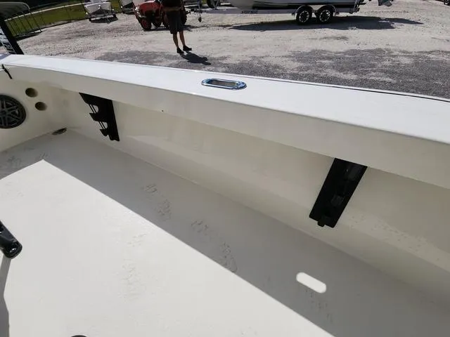Slide: The Image of 2025 Pathfinder 2300 HPS boat interior with rod holders and clean deck. - 32
