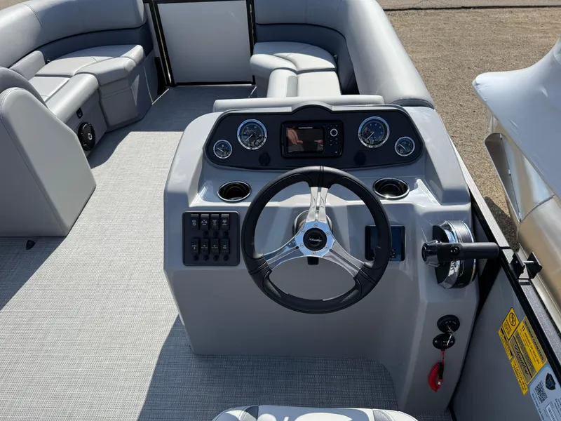 Slide: The Image of 2025 Bentley Pontoons LE 200 CW dashboard with steering wheel and control panel. - 14