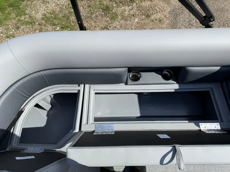 Slide: The Image of 2025 Bentley Pontoons LE 200 CW interior storage compartments and cup holders. - 19
