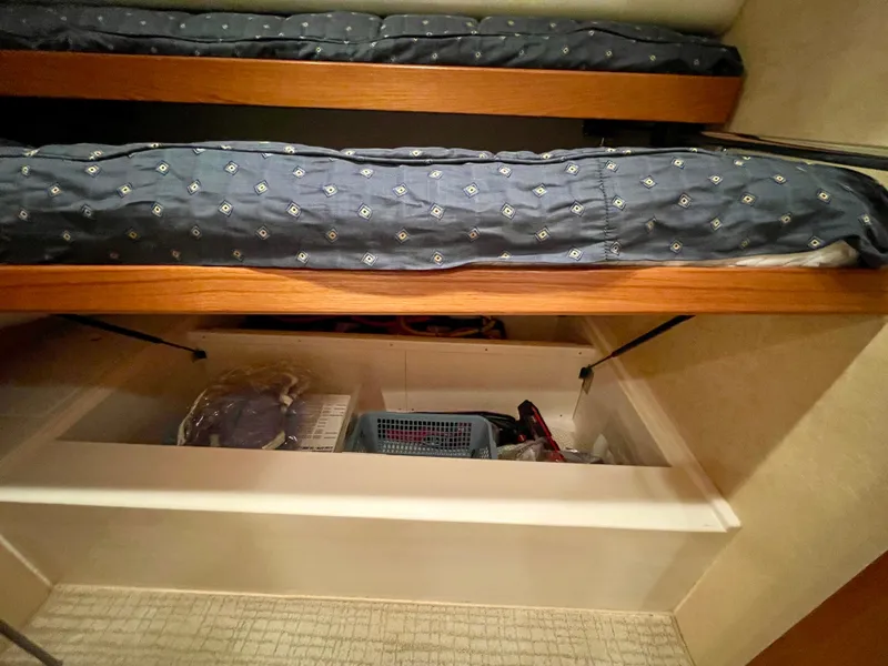 Slide: The Image of Bunk beds with storage in 2006 Cabo 40 Flybridge yacht cabin. - 20