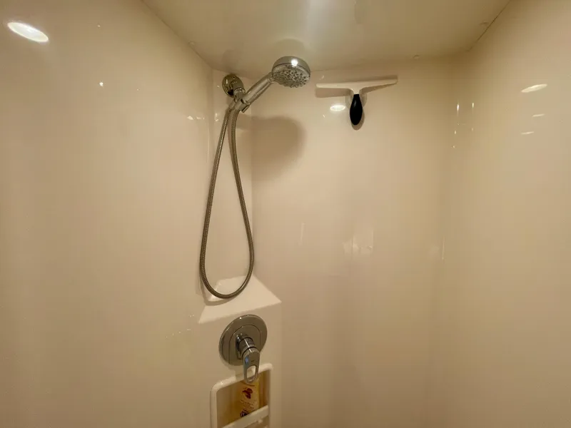 Slide: The Image of Shower area in 2006 Cabo 40 Flybridge yacht, featuring modern fixtures and sleek design. - 24