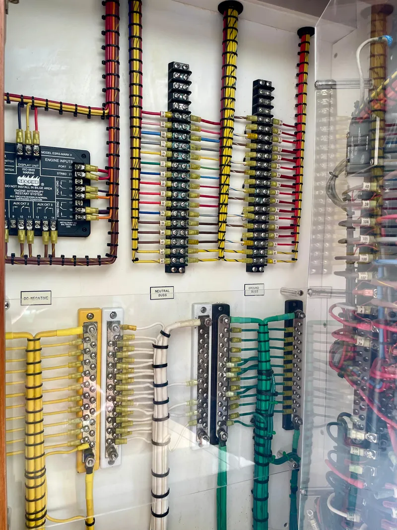 Slide: The Image of Electrical panel with organized wiring in a 2006 Cabo 40 Flybridge boat. - 31