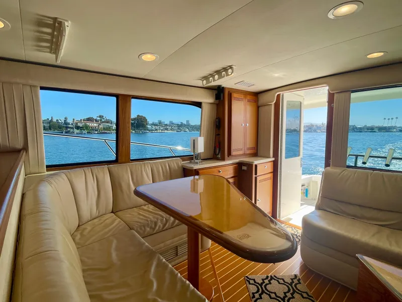 Slide: The Image of Luxurious interior of 2006 Cabo 40 Flybridge yacht with waterfront view. - 38