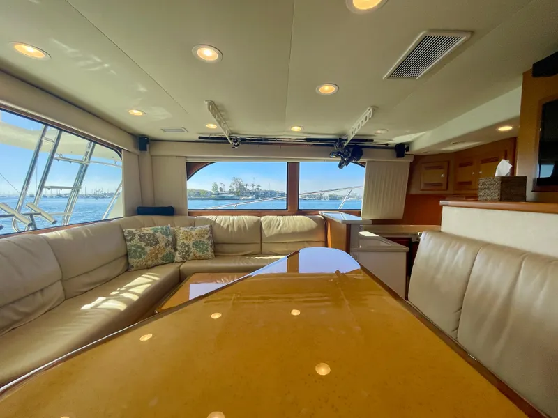 Slide: The Image of Luxurious interior of 2006 Cabo 40 Flybridge yacht with spacious seating and ocean view. - 40