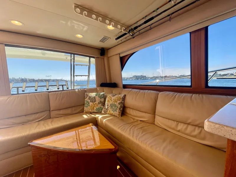 Slide: The Image of Luxurious interior of 2006 Cabo 40 Flybridge yacht with leather seating and ocean view. - 41