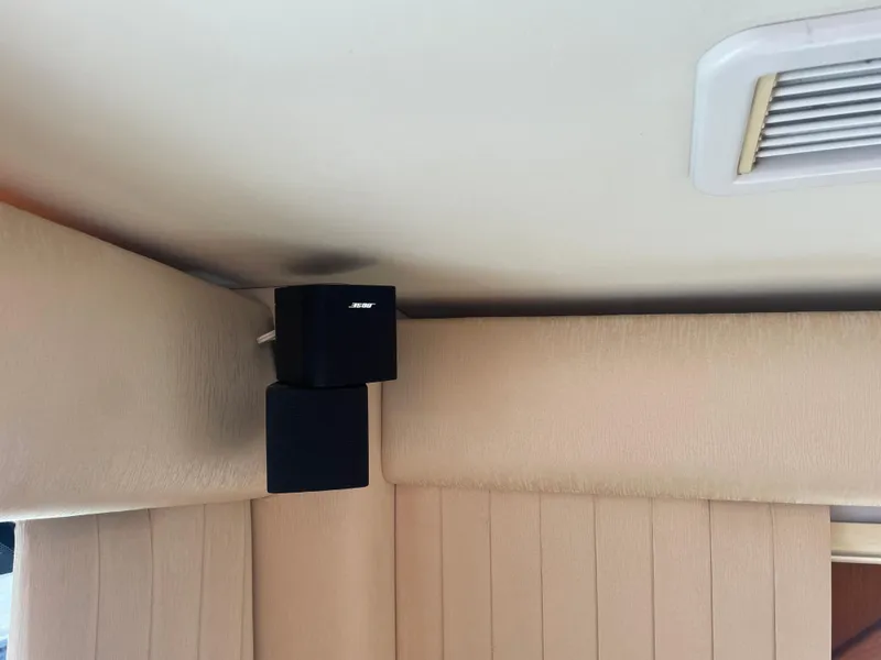 Slide: The Image of Bose speaker mounted on the ceiling of a 2006 Cabo 40 Flybridge yacht. - 42