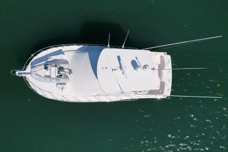 Slide: The Image of Overhead view of 2006 Cabo 40 Flybridge yacht on calm water. - 8