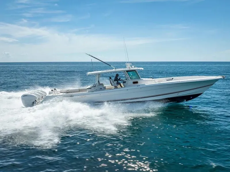 Slide: The Image of 2019 HCB 53 Sueños boat cruising on open water, showcasing speed and elegance. - 1