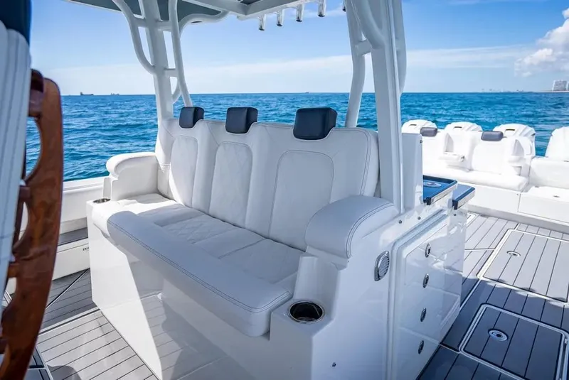 Slide: The Image of Luxury seating on 2019 HCB 53 Sueños boat, ocean backdrop. - 17
