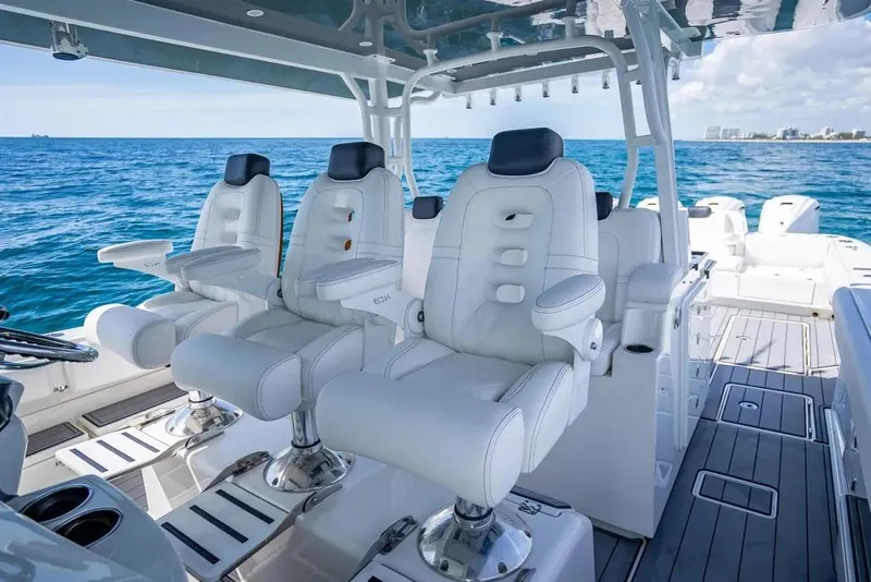 Slide: The Image of Luxury seating on 2019 HCB 53 Sueños boat, ocean view in background. - 18