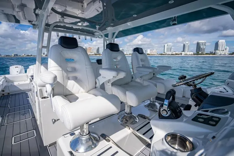 Slide: The Image of Luxurious 2019 HCB 53 Sueños boat interior with plush seating and ocean view. - 19