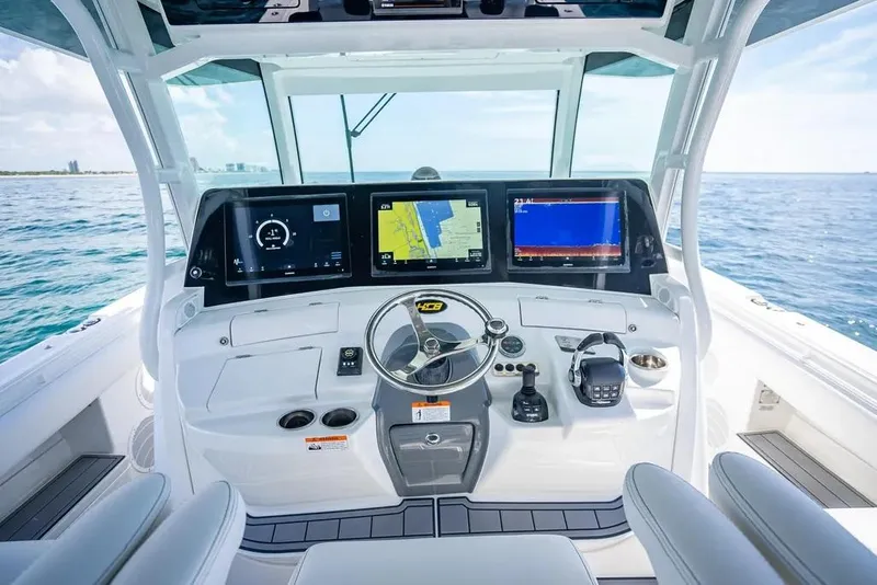 Slide: The Image of Helm of 2019 HCB 53 Sueños boat with advanced navigation displays. - 23