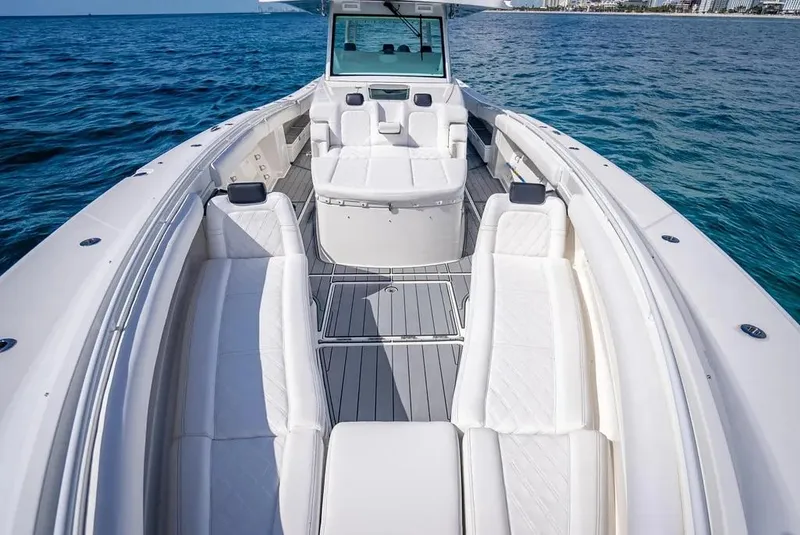 Slide: The Image of 2019 HCB 53 Sueños luxury boat with spacious seating on open water. - 28