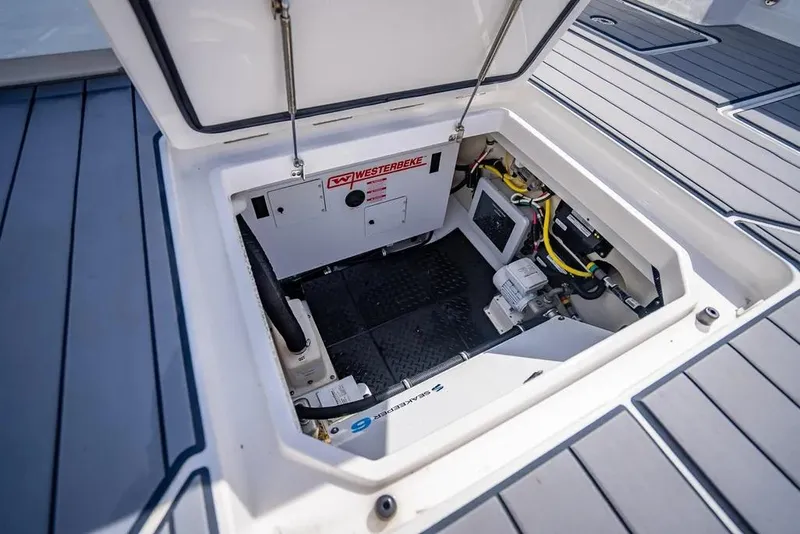 Slide: The Image of Open hatch of 2019 HCB 53 Sueños boat showing engine compartment. - 32