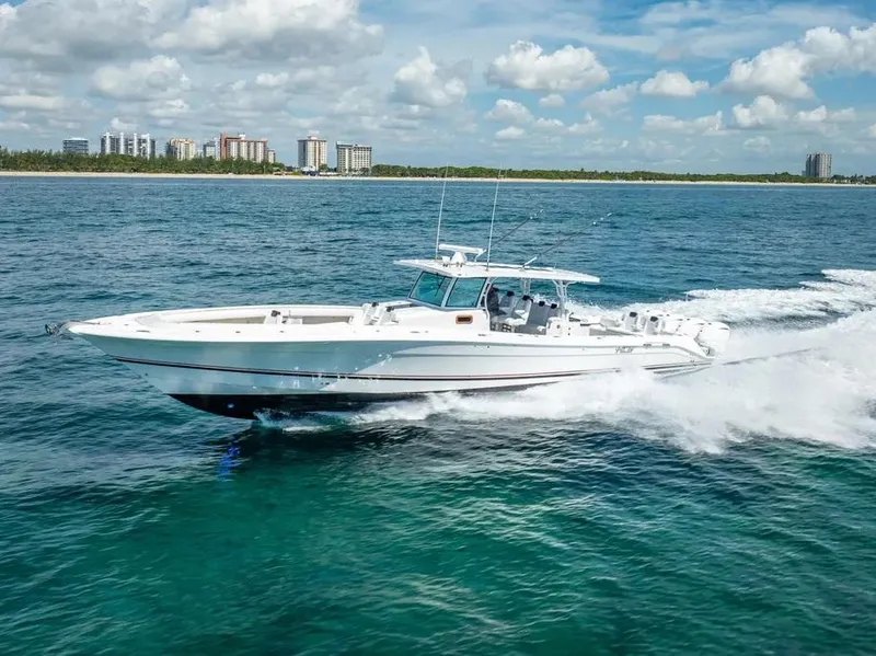 Slide: The Image of 2019 HCB 53 Sueños boat cruising on clear blue ocean waters. - 6