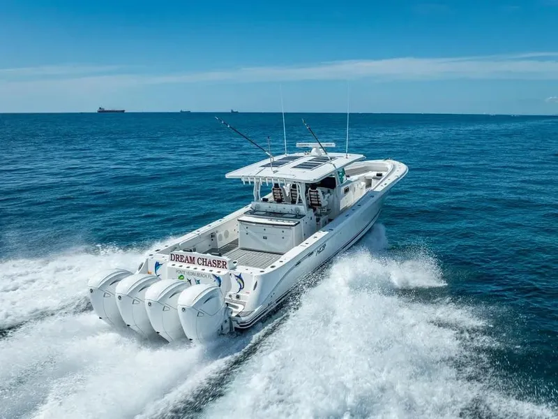 Slide: The Image of 2019 HCB 53 Sueños boat cruising on open ocean with four engines. - 8