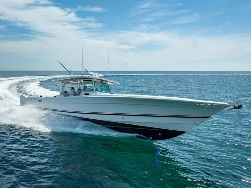 Slide: The Image of 2019 HCB 53 Sueños boat cruising on open ocean under clear blue sky. - 9