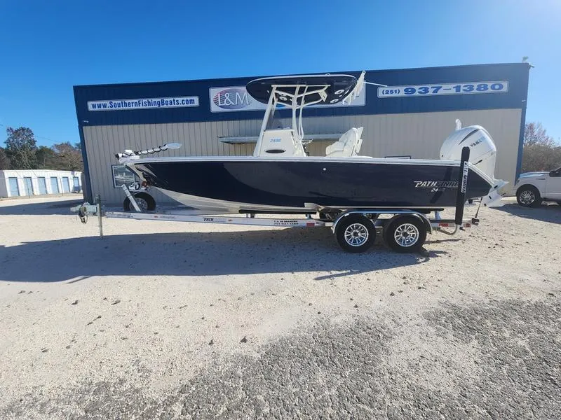 Slide: The Image of 2025 Pathfinder 2400 Open boat on trailer outside Southern Fishing Boats dealership. - 0