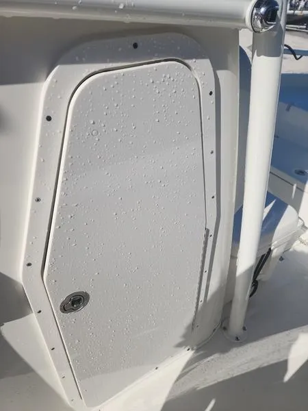 Slide: The Image of 2025 Pathfinder 2400 Open boat compartment door with water droplets. - 13