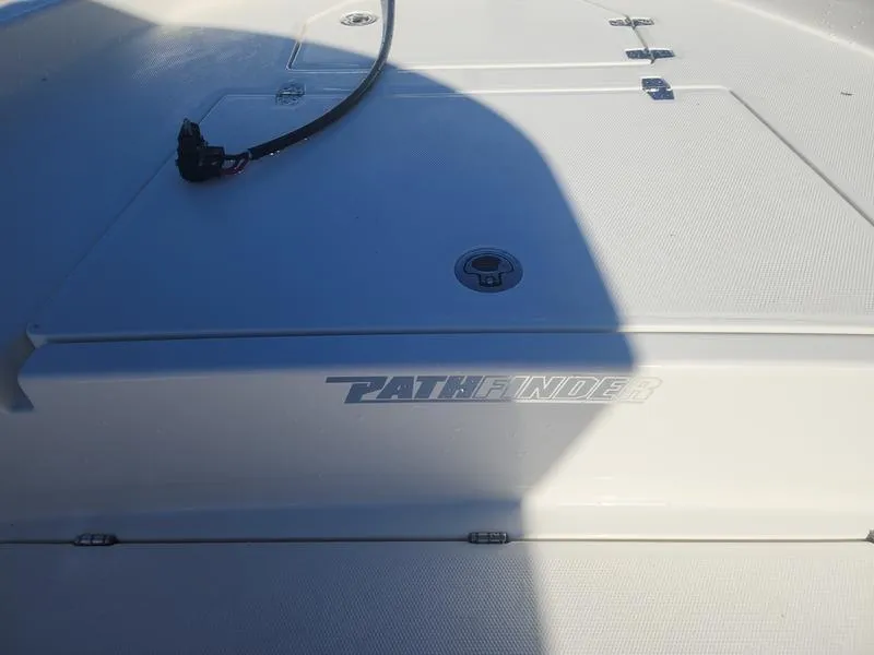 Slide: The Image of 2025 Pathfinder 2400 Open boat deck with logo and shadow. - 16
