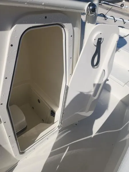 Slide: The Image of 2025 Pathfinder 2400 Open boat storage compartment with open door. - 22