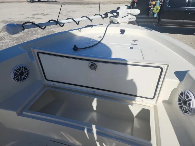 Slide: The Image of 2025 Pathfinder 2400 Open boat deck with storage compartments and speakers. - 9