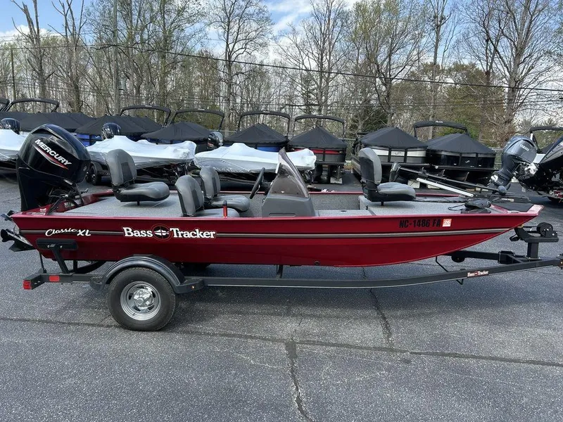 Slide: The Image of 2023 Tracker BASS TRACKER® Classic XL boat in red, parked on a trailer. - 3