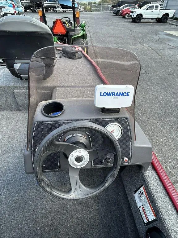 Slide: The Image of 2023 Tracker BASS TRACKER® Classic XL dashboard with Lowrance device and steering wheel. - 5