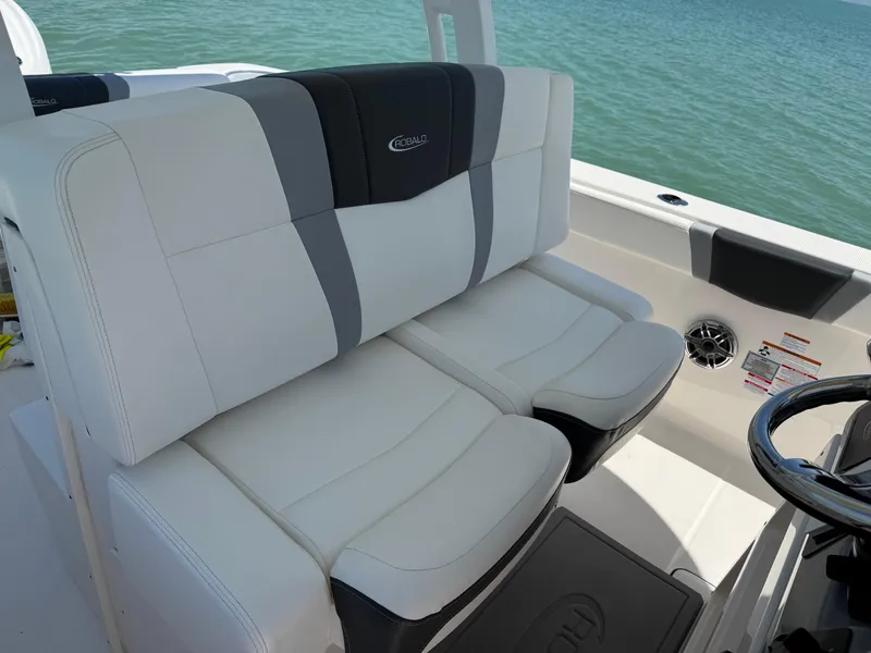 Slide: The Image of 2022 Robalo R272 Center Console boat seats with ocean backdrop. - 4
