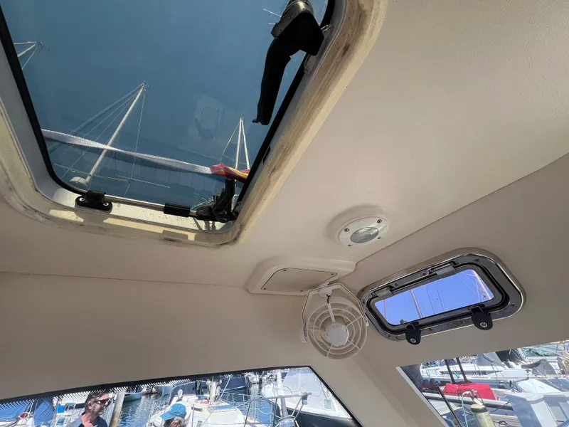 Slide: The Image of Interior view of 2006 Mainship Pilot 30-II Sedan, showing ceiling hatch and windows. - 14