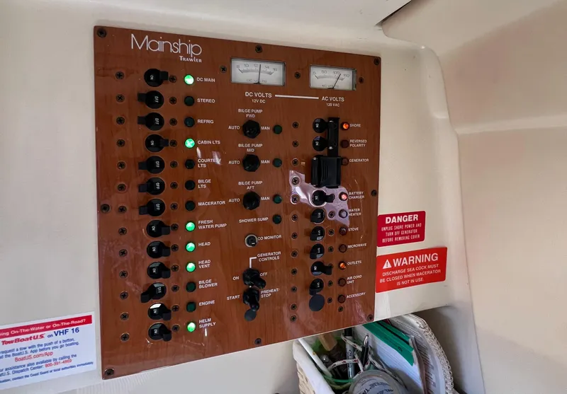 Slide: The Image of Electrical control panel of 2006 Mainship Pilot 30-II Sedan boat. - 30