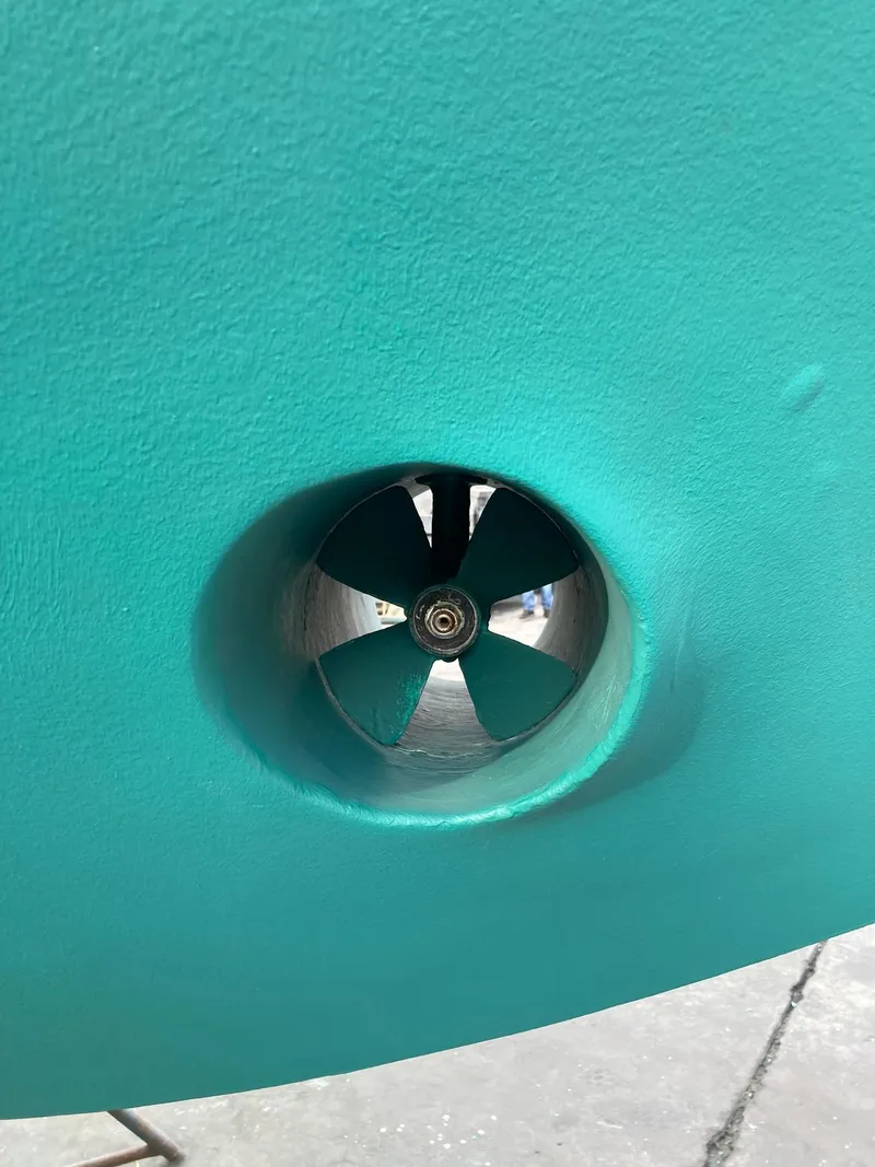 Slide: The Image of 2006 Mainship Pilot 30-II Sedan bow thruster detail in turquoise hull. - 35